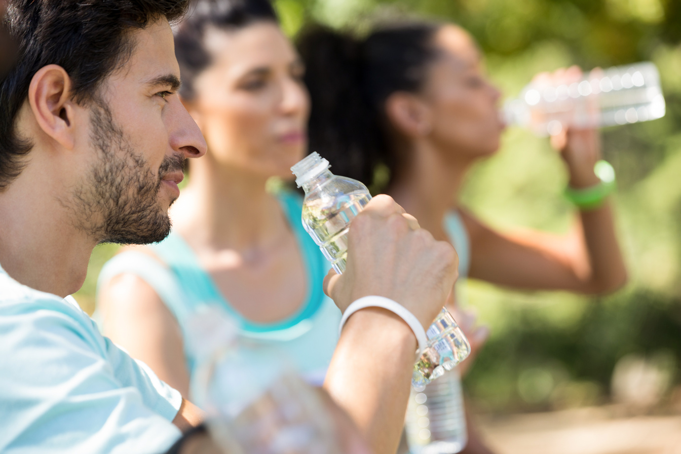 Marathon athletes having water